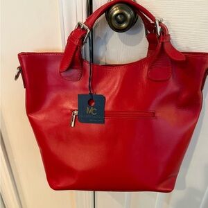 Red leather handbag with silver hardware by Massimo Castelli